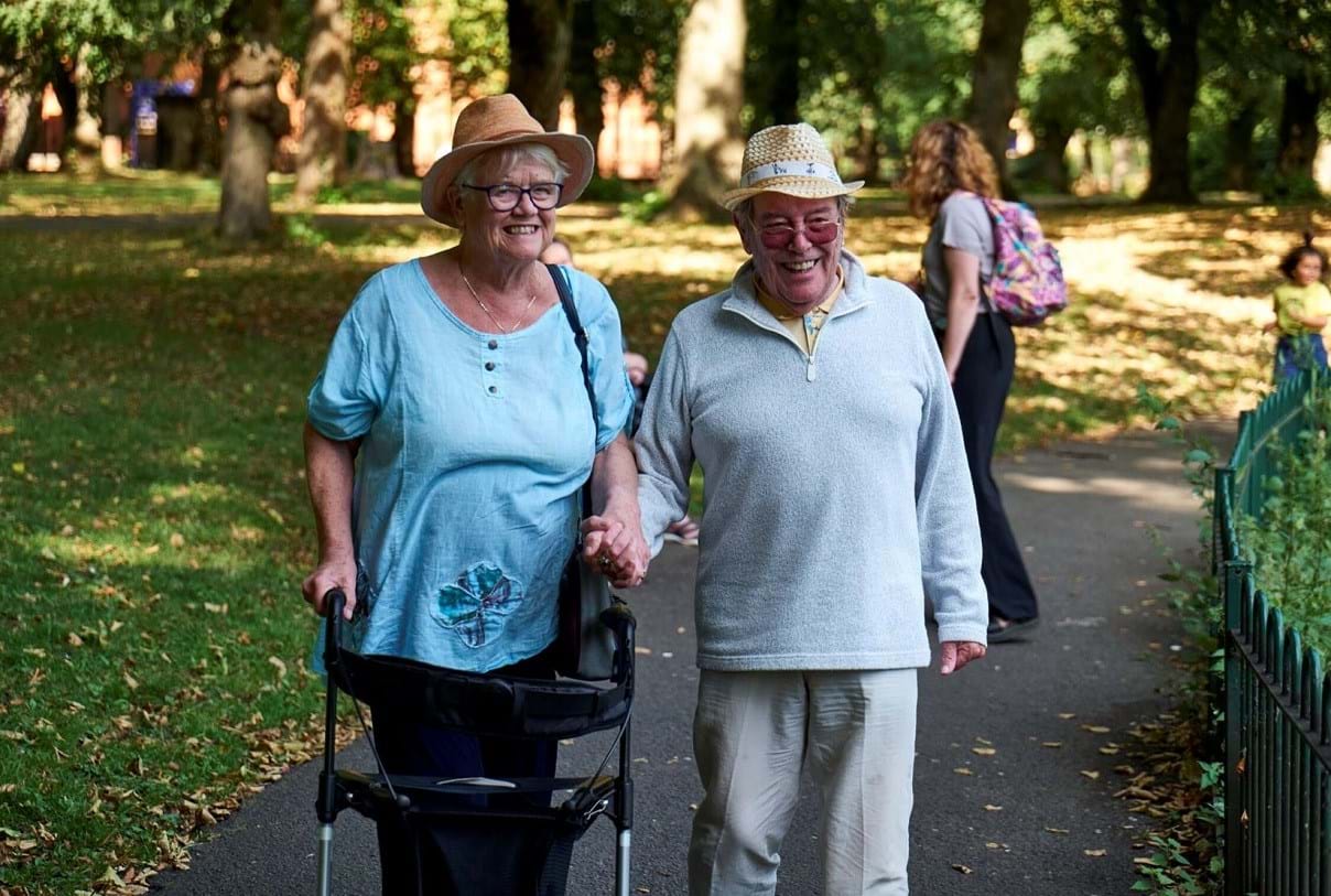 older couple walking in the park